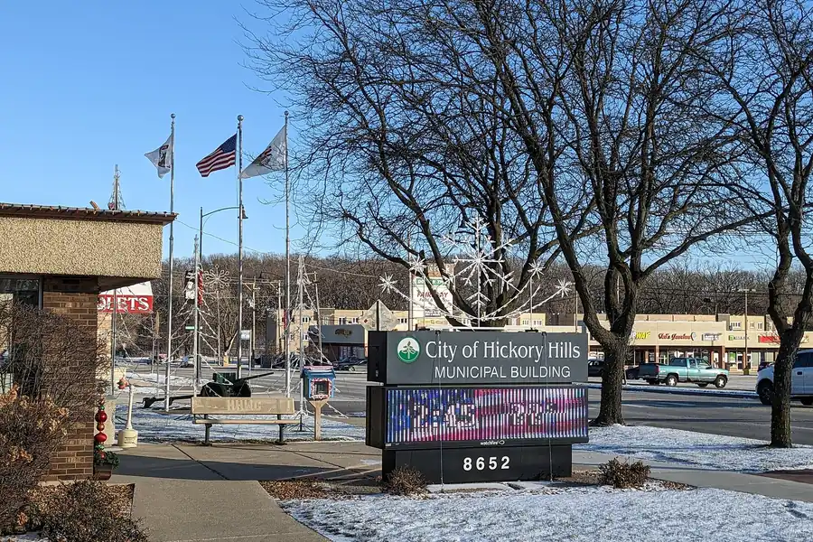 Hickory Hills municipal building sign and flags in the snow, Hickory Hills, Illinois